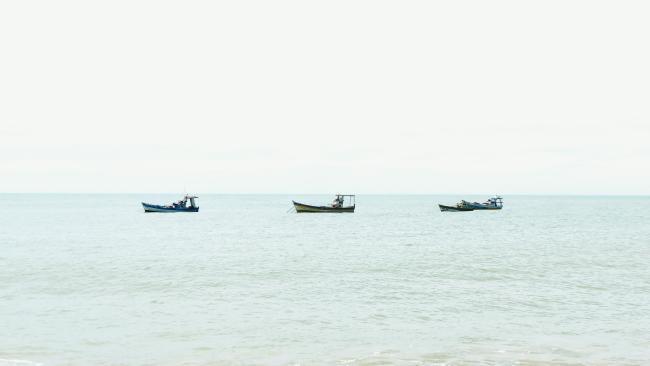3 boats on the Horizon in a calm Mexican bay